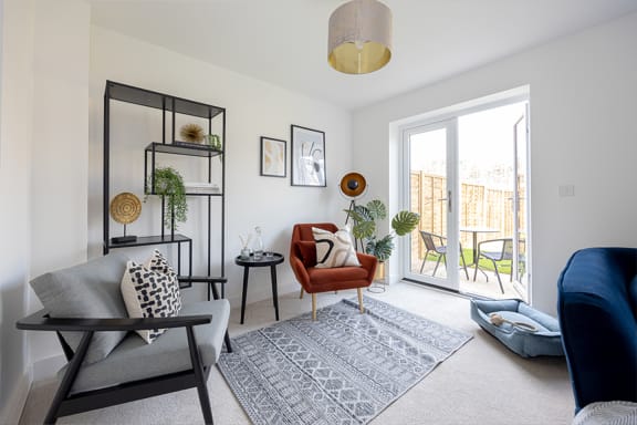 a living room with a couch and a glass table