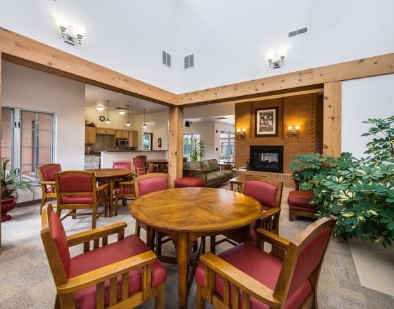 the lobby of a building with a fireplace