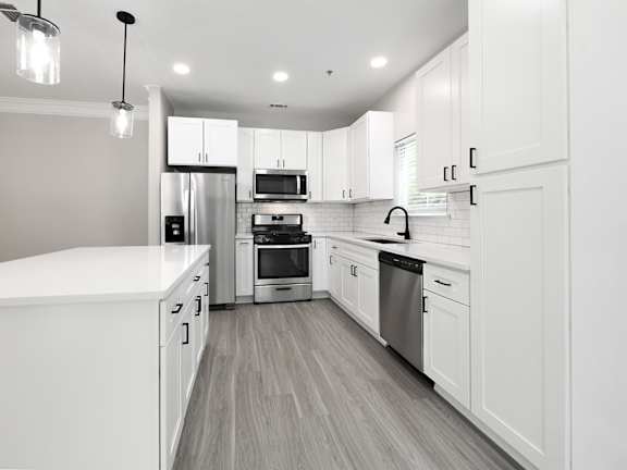 BRAND NEW SUITES - quartz countertops, stainless steel appliances, large islands and matte black finishes and hardware