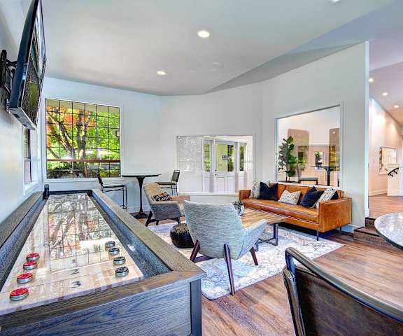a living room with a bar and a dining room