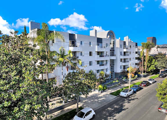 Exterior aerial view of an apartment building with cars parked at Midvale Towers Apartments Westwood, California 90024