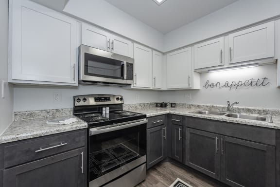 Kitchen appliances and cabinets at Bloomfield Apartments, Ohio