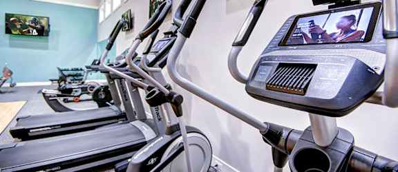 The Reserve at Bucklin Hill gym with treadmill and TV