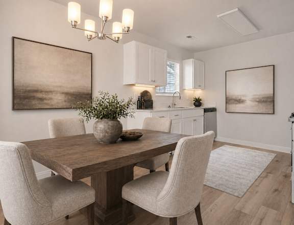 A dining room with a wooden table and chairs.