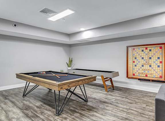 the retreat apartments l game room with pool table and foosball