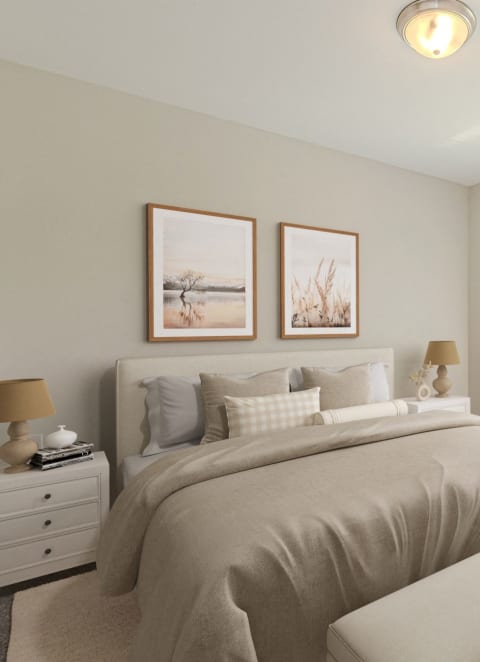 a living room with a white couch and two white chairs with blue and white pillows at Shannon Reserve 55+ Apartments, Union City, GA