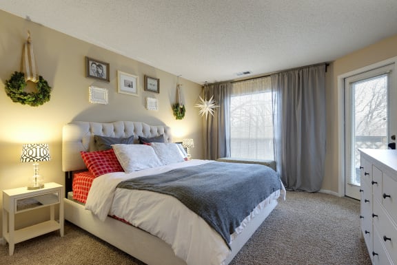 a bedroom with a bed and a window  at Regency Woods, Minnetonka, MN, 55305