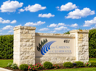 The entrance sign to The Gardens at Clearwater Active Senior Living.