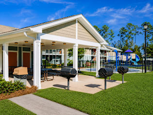 A small building with a porch and a mailbox.
