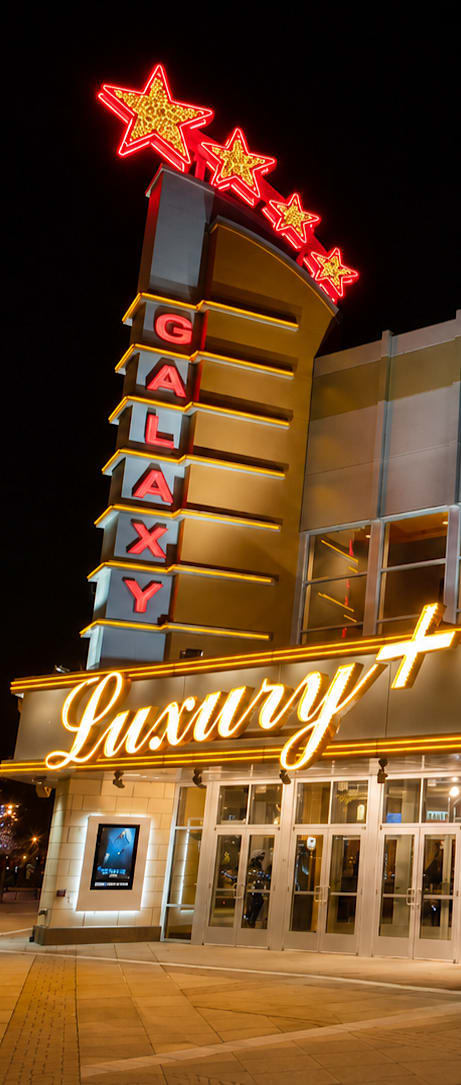 A luxury IMAX cinema at night.