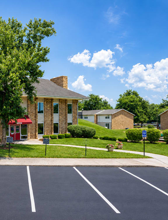 A building with a red awning and a sign that says "Burning Tree Information & Business Center".