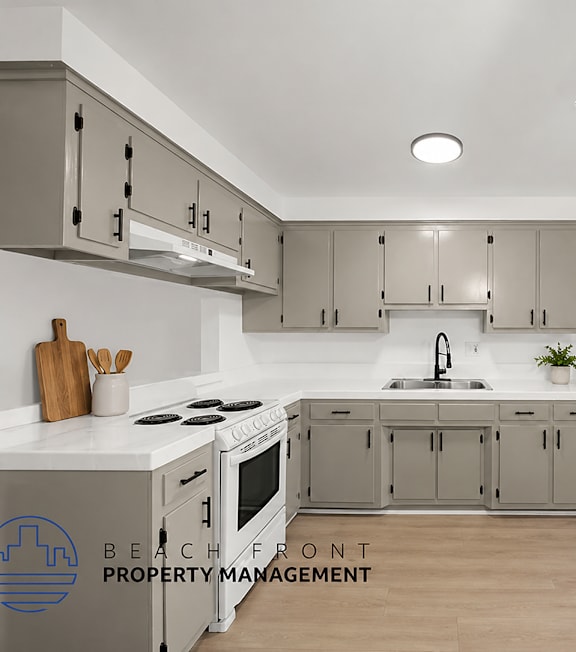 A well-lit, modern kitchen and living room with a dining area.