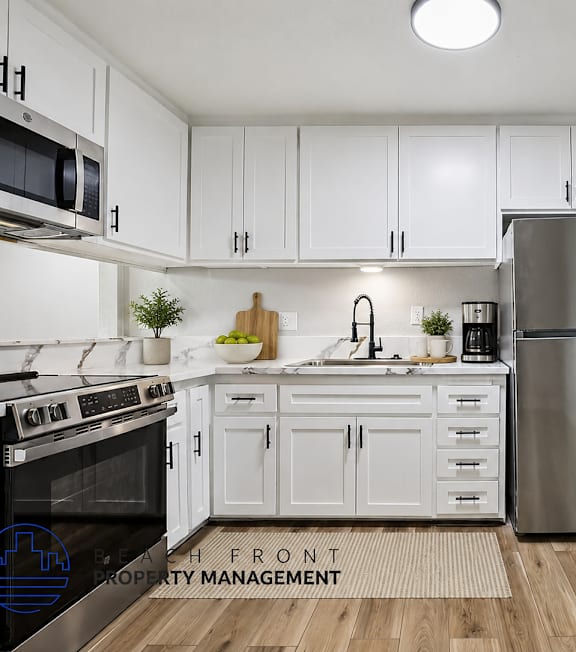 A well-lit, modern kitchen and living room with a dining area.