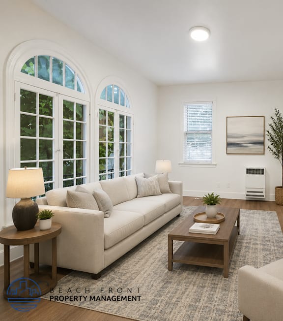 A well-lit, modern kitchen and living room with a dining area.