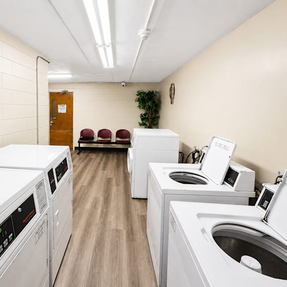 A row of washing machines in a laundromat.