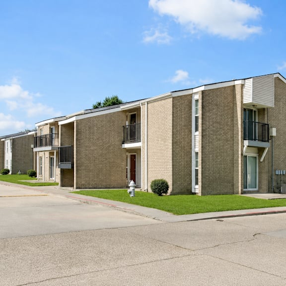 A row of houses with a clear blue sky above them.