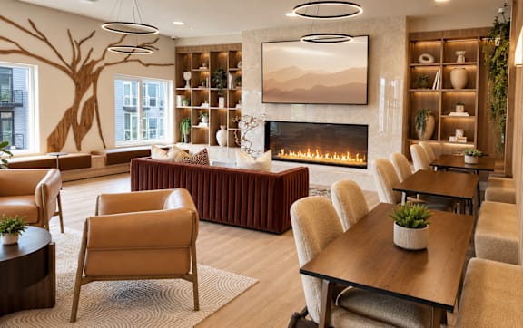 A living room with a fireplace and a large painting on the wall.