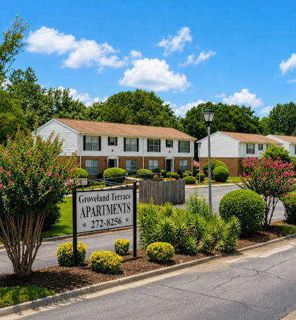 Groveland Terrace Apartments is a residential complex with a well-maintained garden in front.