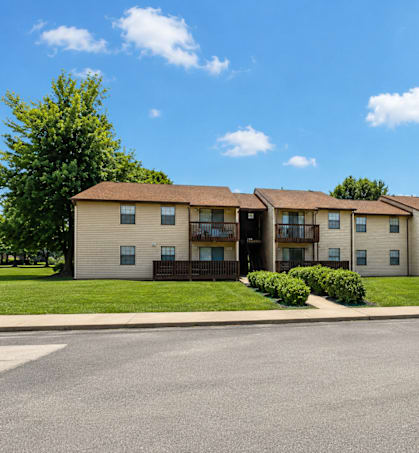 Apartment complex with a clear blue sky above.