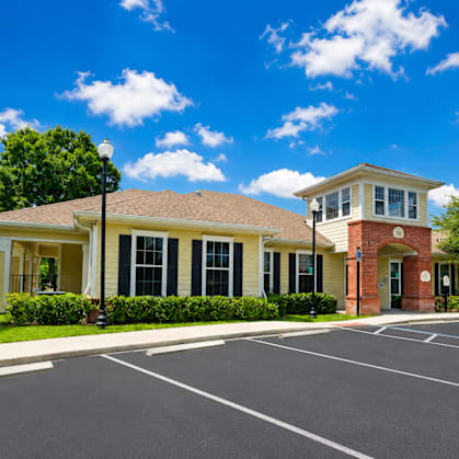 A building with a parking lot in front of it.