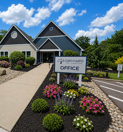 The Orchard of Landen office is surrounded by a well-manicured garden.