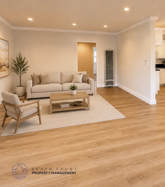 A living room with a couch, chair, and a rug.