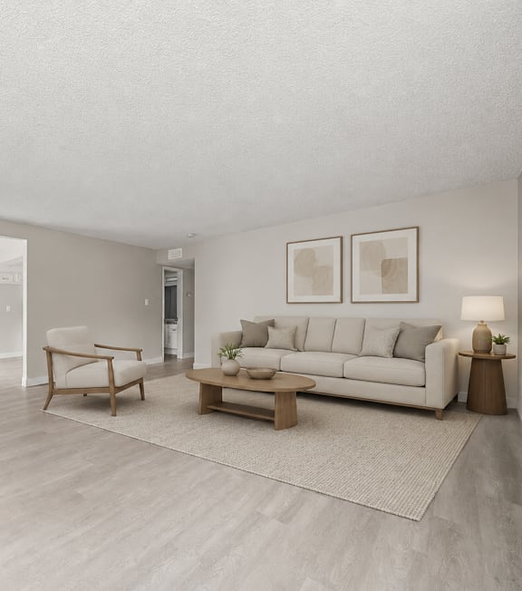 A well-lit, modern kitchen and living room with a dining area.