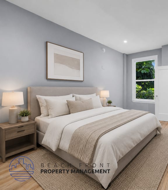 A spacious room with a ceiling fan and a window overlooking greenery.