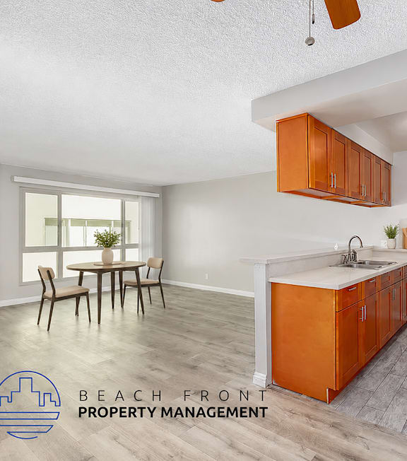 A well-lit, modern kitchen and living room with a dining area.