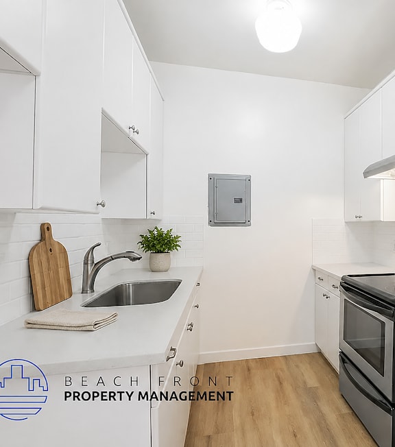 A well-lit, modern kitchen and living room with a dining area.