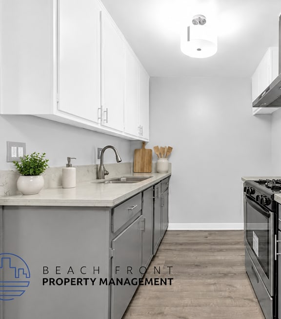 A well-lit, modern kitchen and living room with a dining area.