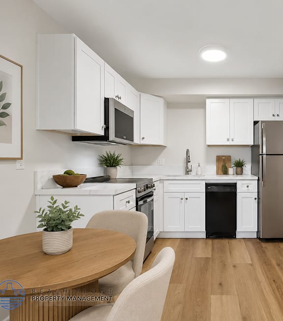 A well-lit, modern kitchen and living room with a dining area.
