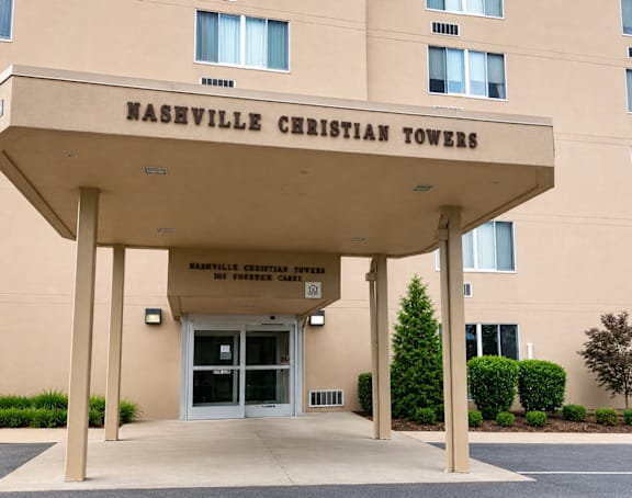 The front of the Naseville Christian Towers building is shown.