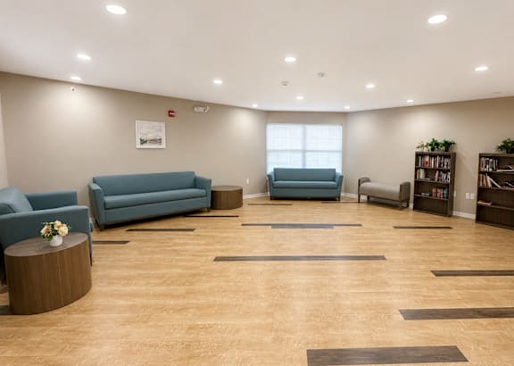 A kitchen with wooden floors and stainless steel appliances.at Hawthorne Pointe, Bondurant, 50035