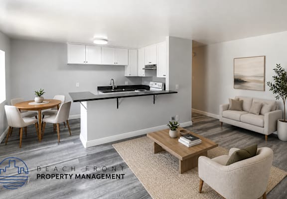 A modern living room with a dining area and a kitchen in the background.