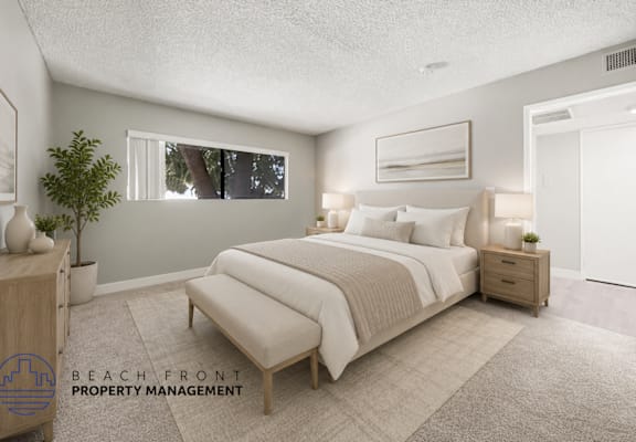 A well-lit bedroom with a large bed and a window.