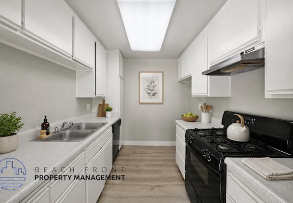 A kitchen with a stove top oven and a sink.