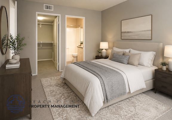 A bedroom with a large bed, a dresser, and a mirror.