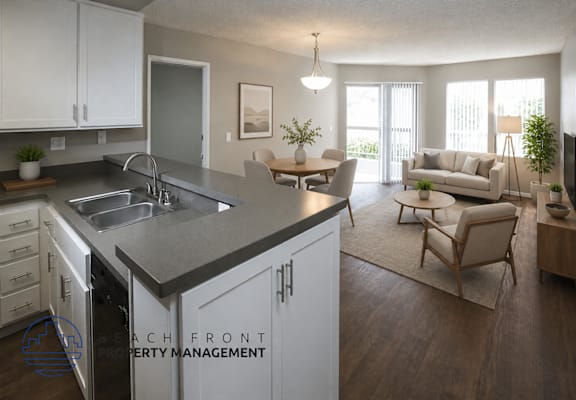 A modern kitchen with a dining area and a living room.