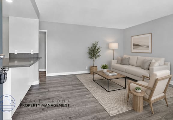 A living room with a couch, chair, and coffee table.