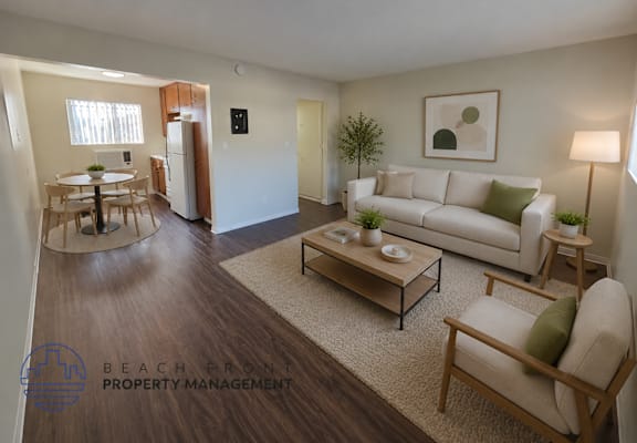 A living room with a couch, chair, and coffee table.