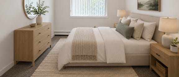 A bedroom with a bed, nightstand, and a painting on the wall.