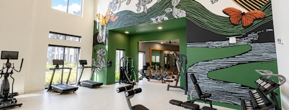 Modern fitness center with cardio and strength equipment at The Bluewood