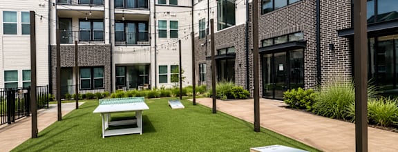 Outdoor lawn games and gathering space at The Bluewood