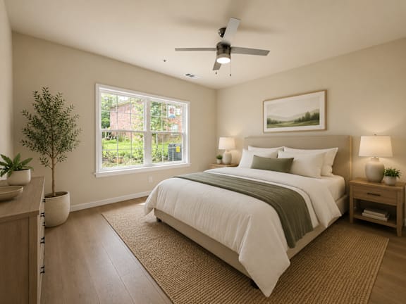 A bedroom with a large bed and a ceiling fan.