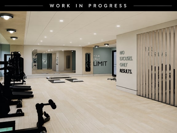A gym with a sign that says "No Excuses. Your Limit Is Only Results."