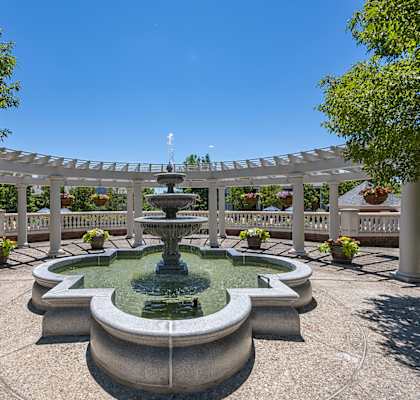 a fountain in the center of a park with a pergola at Bishops Gate, Cincinnati, OH, 45249