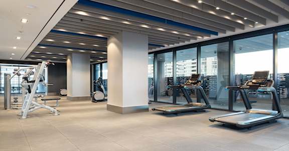 a gym with a view of the city