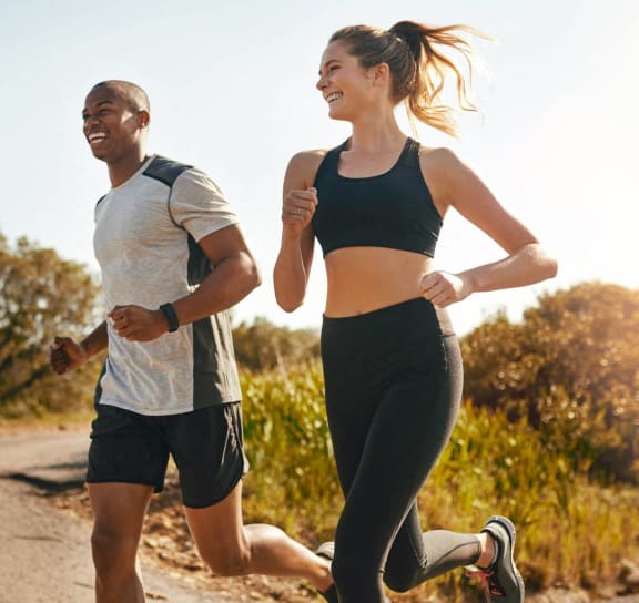 two people running outside at River Crossing Apartments, St. Charles, MO, 63303