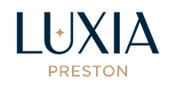 A black and white logo with the word "LUXIA" in large letters and "PRESTON" in smaller letters below it.